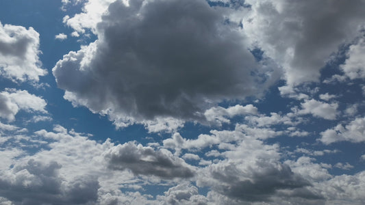 Video - Timelapse - Storm clouds forming in blue sky