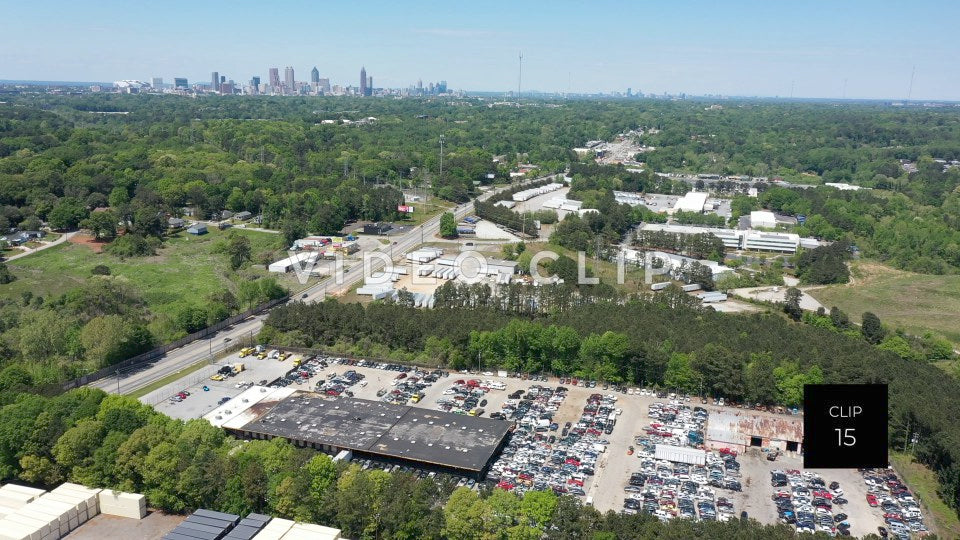 CLIP 15 - Atlanta, GA flying over industrial complex towards city skyline