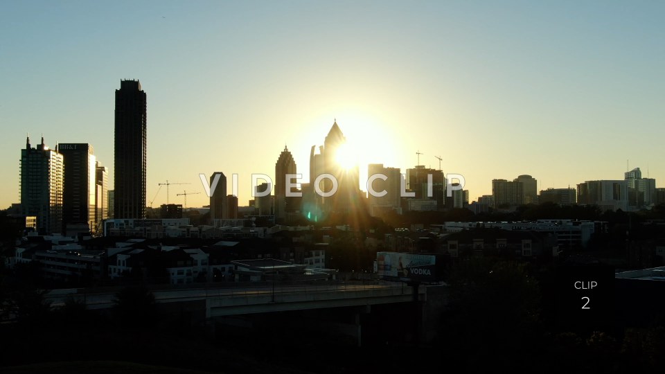 CLIP 2 - Atlanta, GA early morning sunshine behind city buildings in downtown