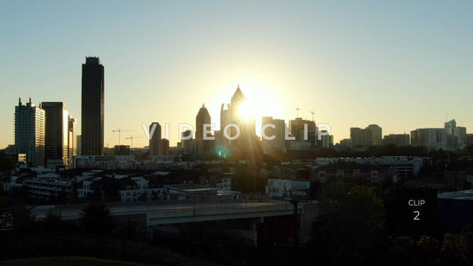 CLIP 2 - Atlanta, GA early morning sunshine behind city buildings in downtown